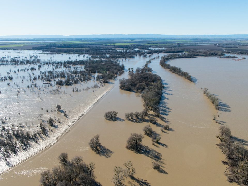 Aerial view of floodwaters overtopping the Fremont Weir in Knights Landing, Calif.