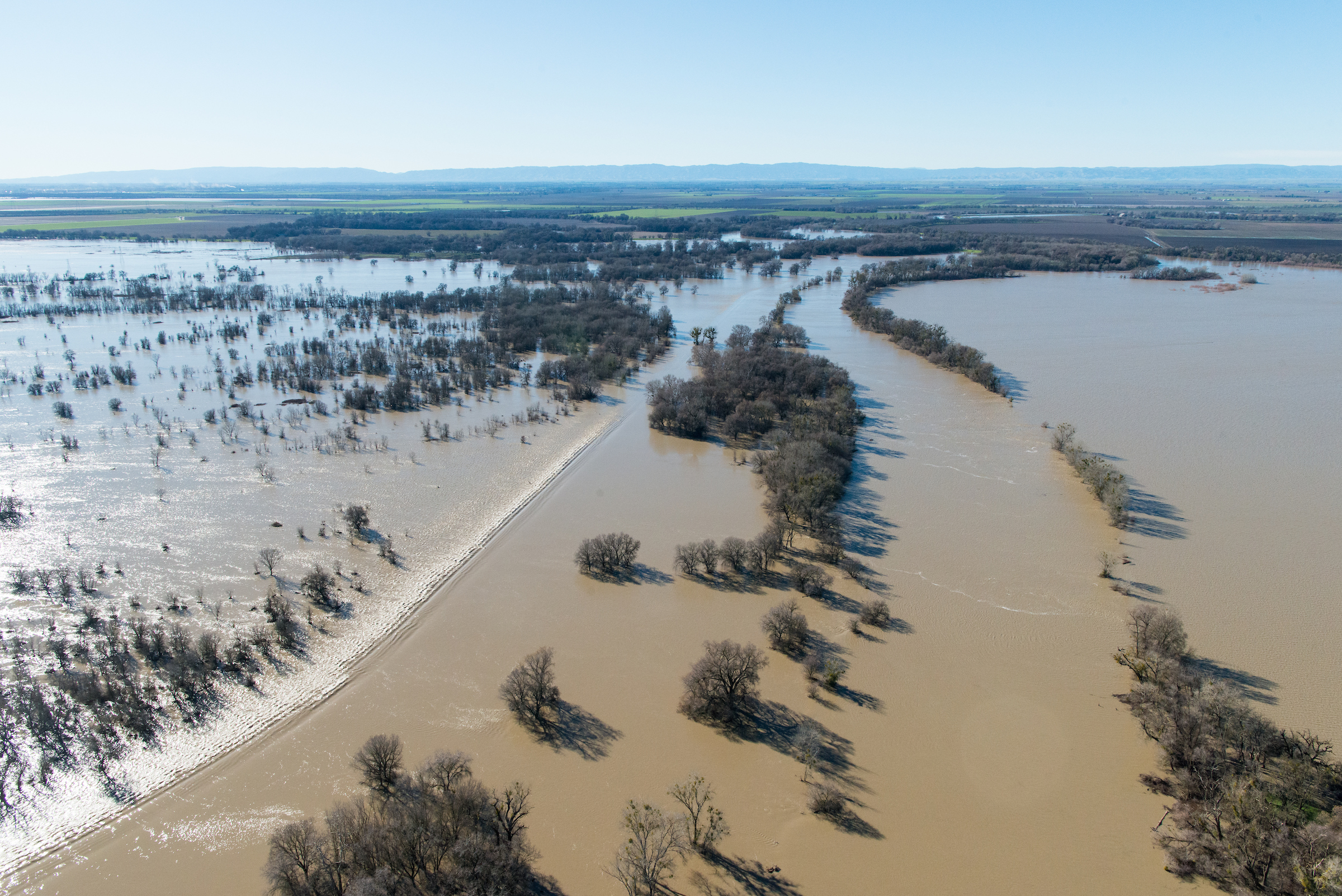 Aerial view of floodwaters overtopping the Fremont Weir in Knights Landing, Calif.