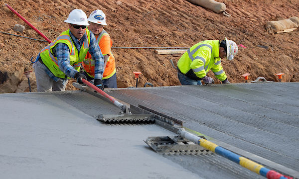 California Department of Water Resources' contractors provide a V-groove finish on the new launch ramp as part of the boat ramp facility at Loafer Point
